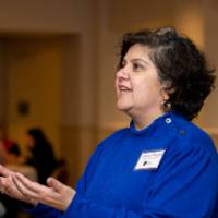 Faculty conversing with one another